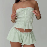 Women's green bandeau tube top and matching plaid shorts set.